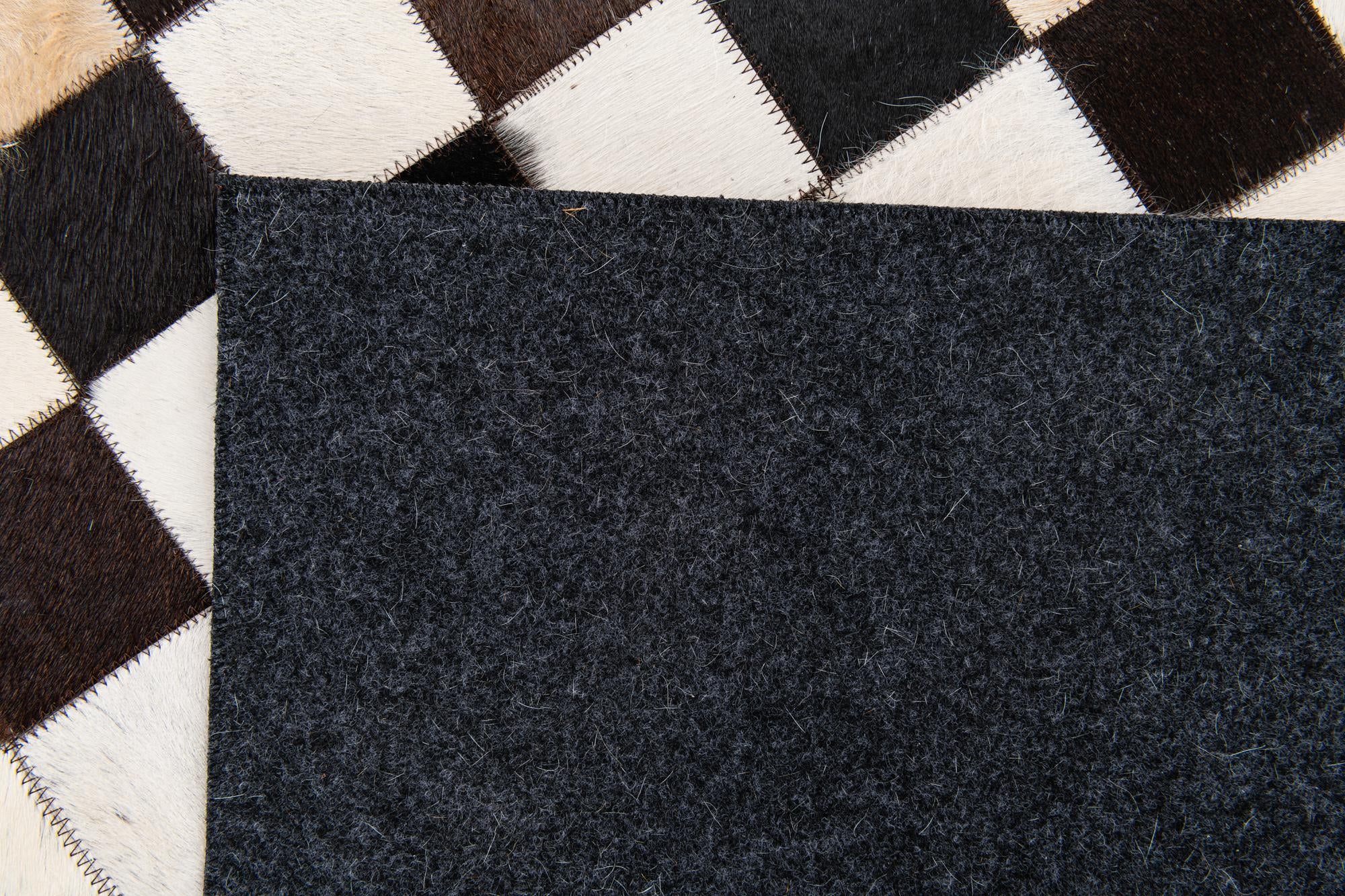 5' x 8' Cowhide Stocks Rug
