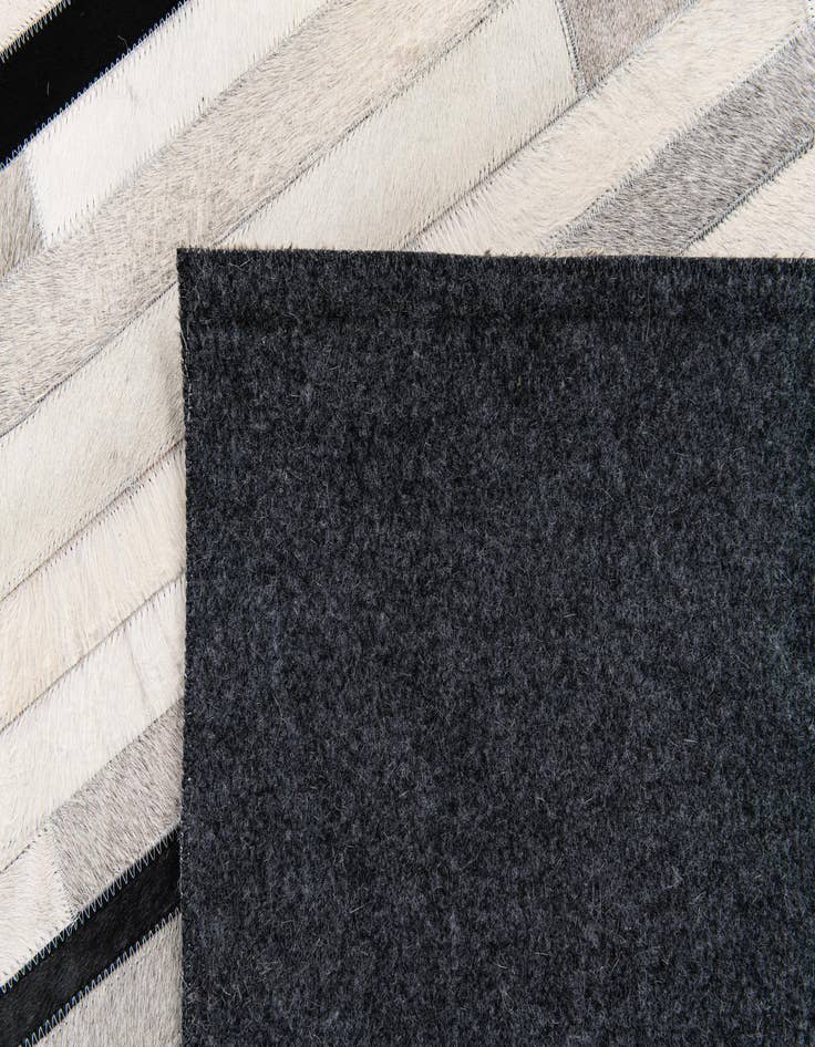 Detail image of 5' 1 x 7' 11 Cowhide Stocks Rug