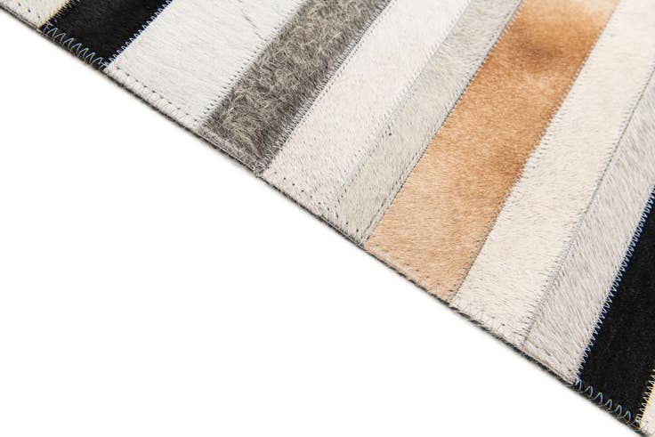 Detail image of 5' 1 x 8' Cowhide Stocks Rug