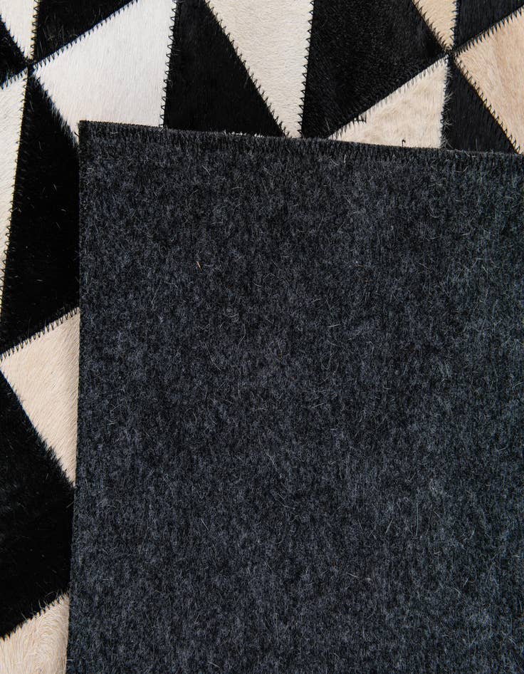 Detail image of 5' 2 x 8' Cowhide Stocks Rug
