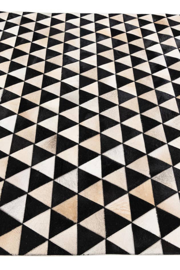 Detail image of 5' 1 x 8' 1 Cowhide Stocks Rug