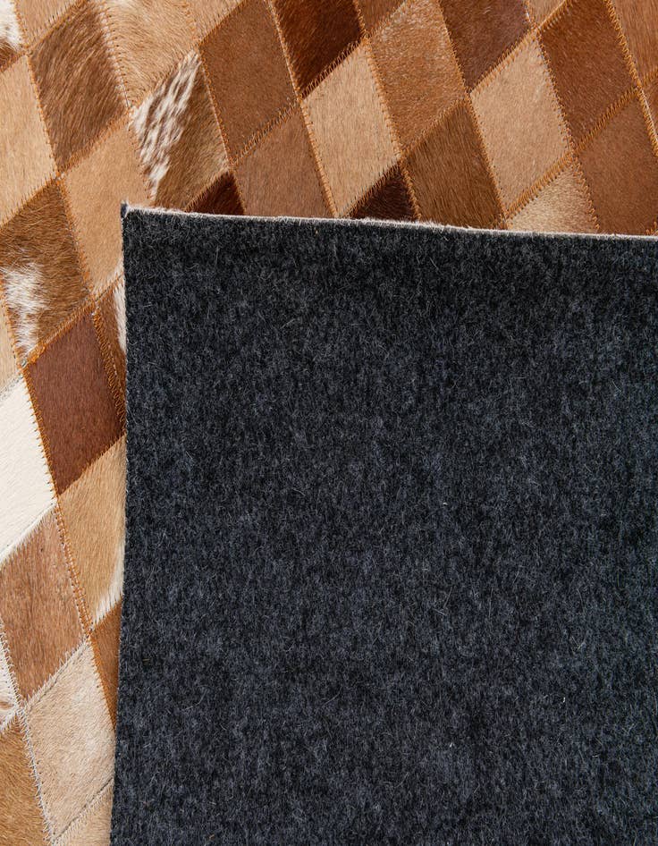 Detail image of 4' 11 x 7' 9 Cowhide Stocks Rug