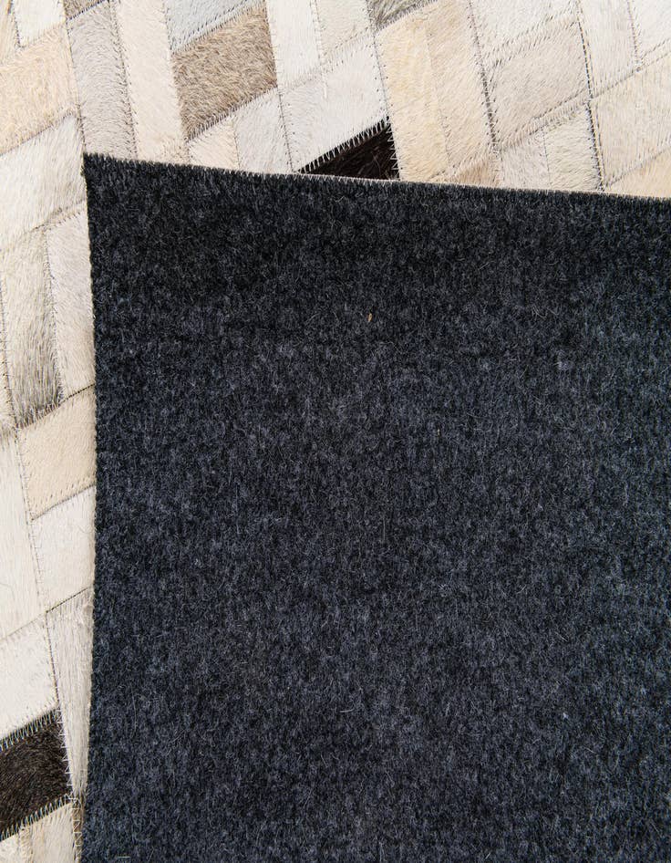 Detail image of 5' 3 x 7' 5 Cowhide Stocks Rug