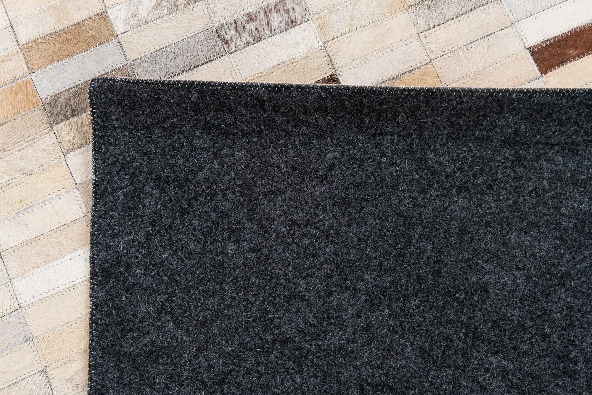 5' 1 x 7' 10 Cowhide Stocks Rug