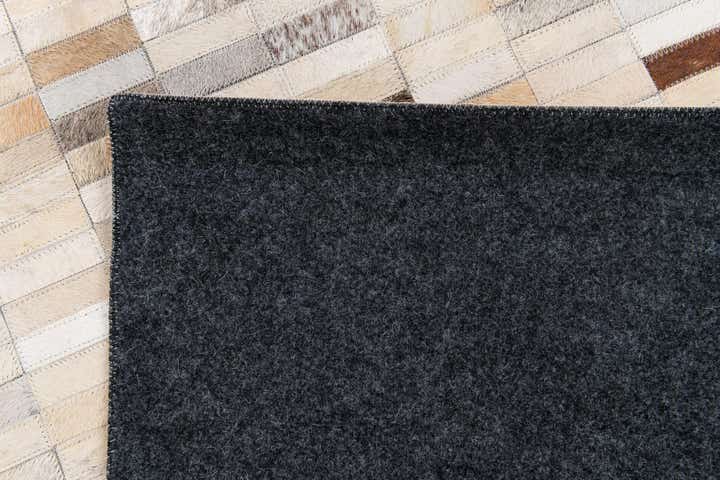 5' 1 x 7' 10 Cowhide Stocks Rug