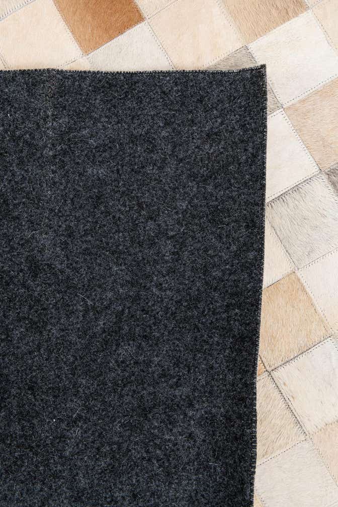 5' 1 x 7' 10 Cowhide Stocks Rug