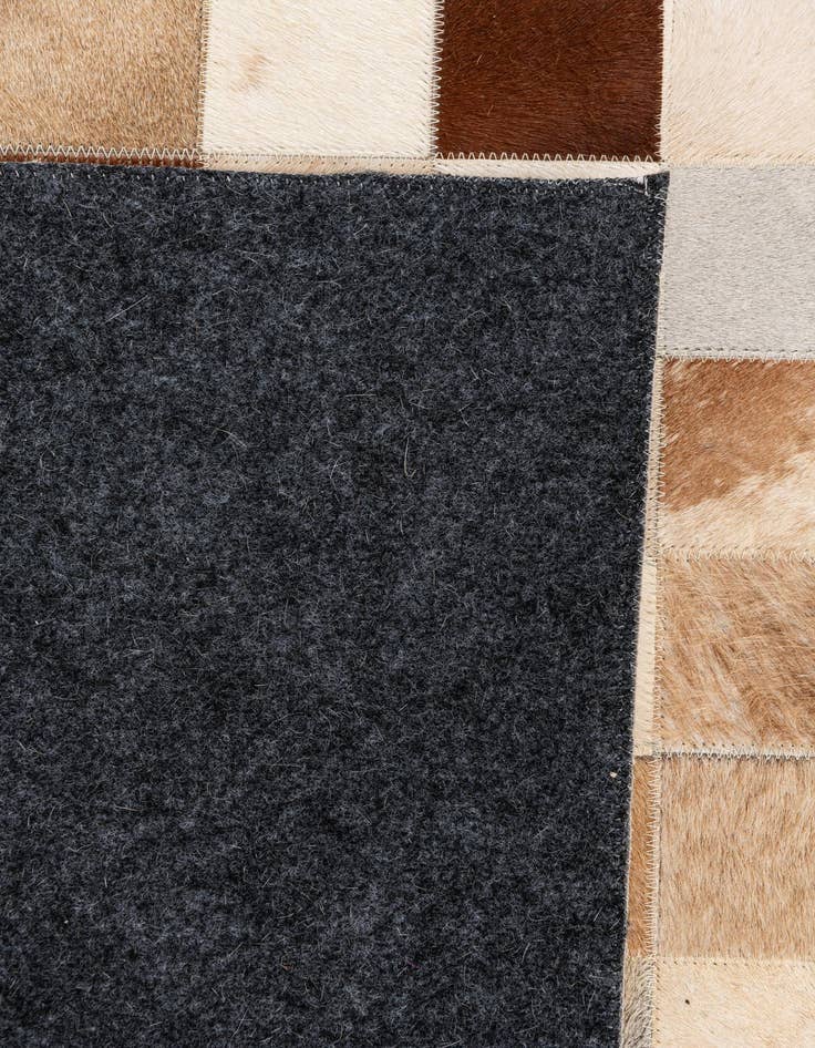 Detail image of 5' 1 x 8' 1 Cowhide Stocks Rug