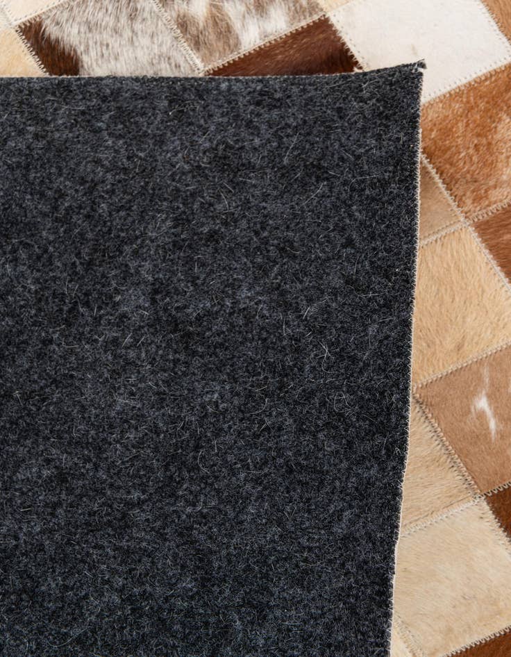 Detail image of 5' 1 x 7' 11 Cowhide Stocks Rug