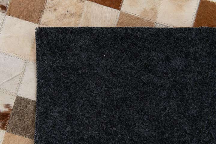 5' 2 x 8' 1 Cowhide Stocks Rug
