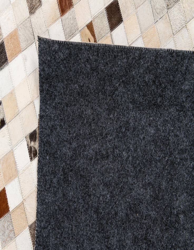 Detail image of 5' x 7' 11 Cowhide Stocks Rug