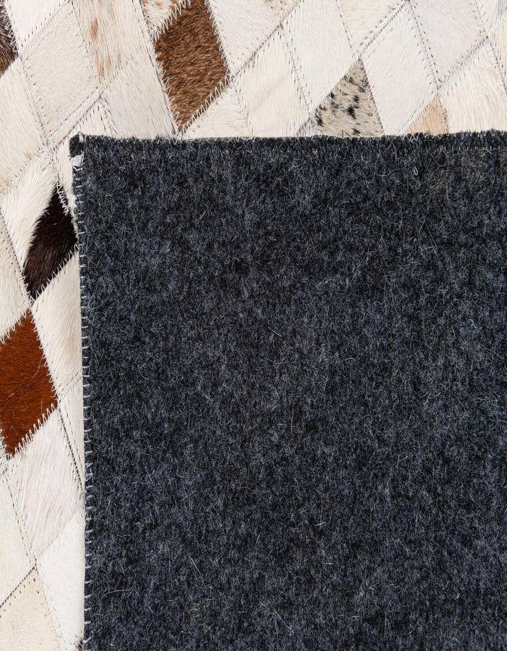 Detail image of 5' x 7' 11 Cowhide Stocks Rug