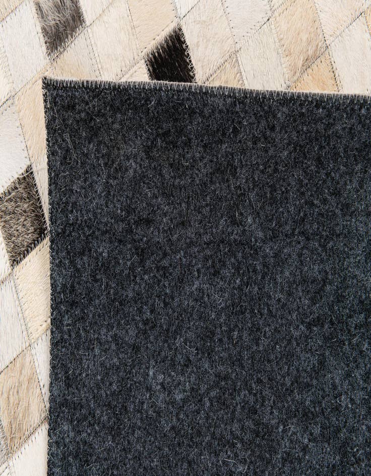 Detail image of 5' x 7' 11 Cowhide Stocks Rug