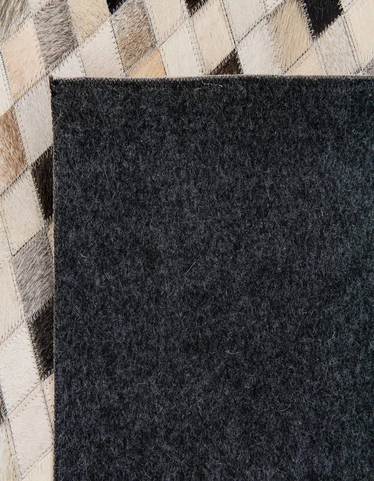 Detail image of 5' x 7' 11 Cowhide Stocks Rug