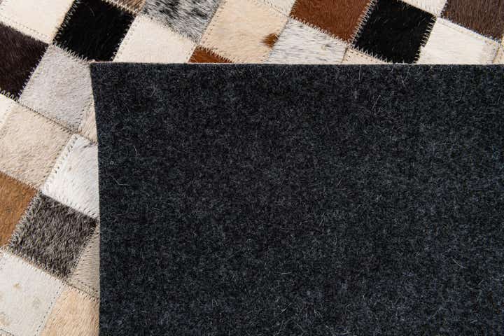 5' 1 x 7' 10 Cowhide Stocks Rug