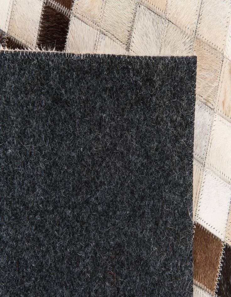 Detail image of 5' 1 x 8' Cowhide Stocks Rug