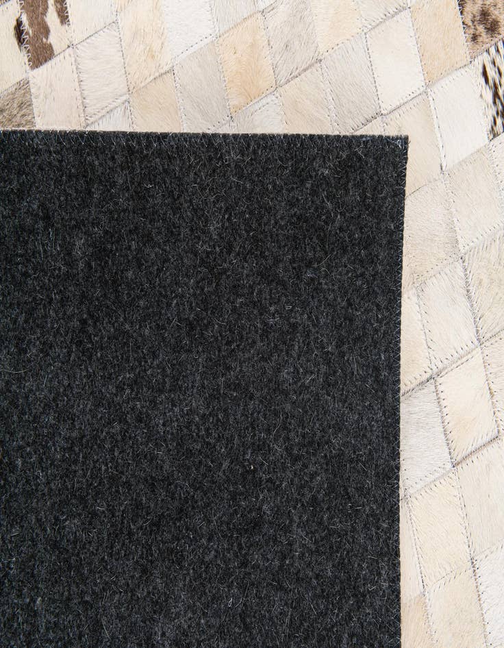 Detail image of 5' x 7' 11 Cowhide Stocks Rug