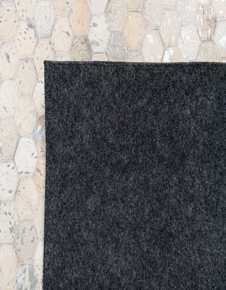 Detail image of 5' 1 x 8' 1 Cowhide Stocks Rug