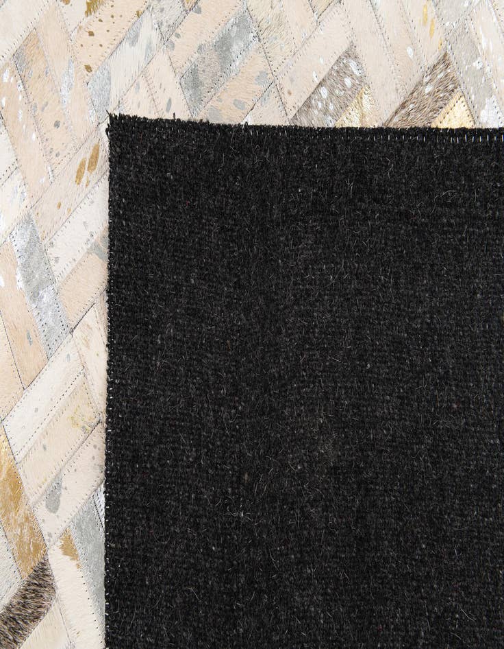 Detail image of 5' x 7' 11 Cowhide Stocks Rug