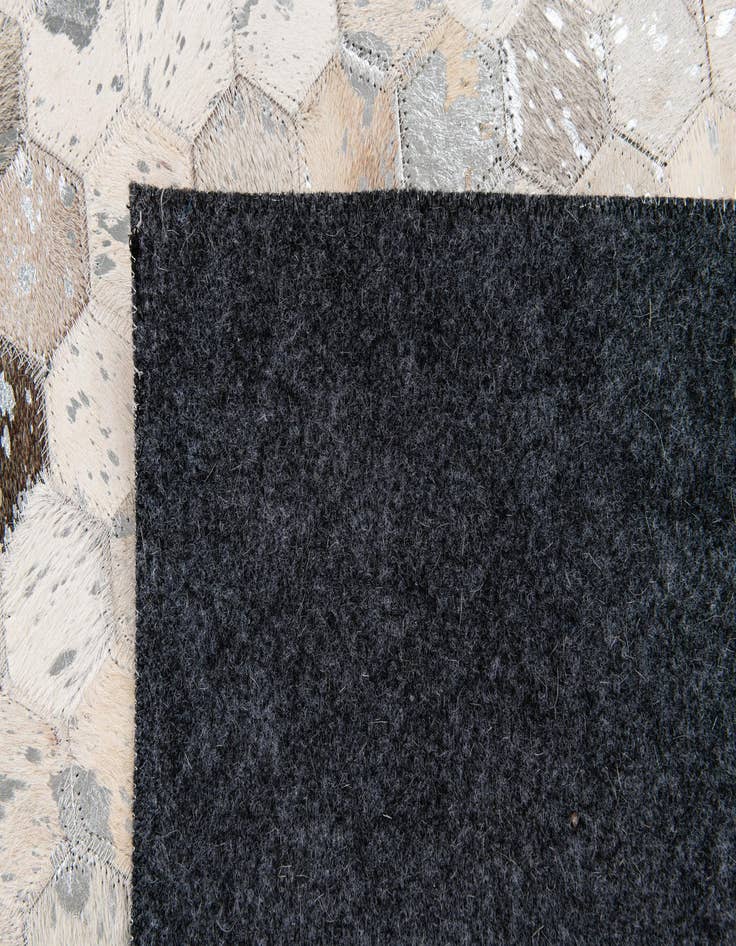 Detail image of 5' 1 x 8' 2 Cowhide Stocks Rug