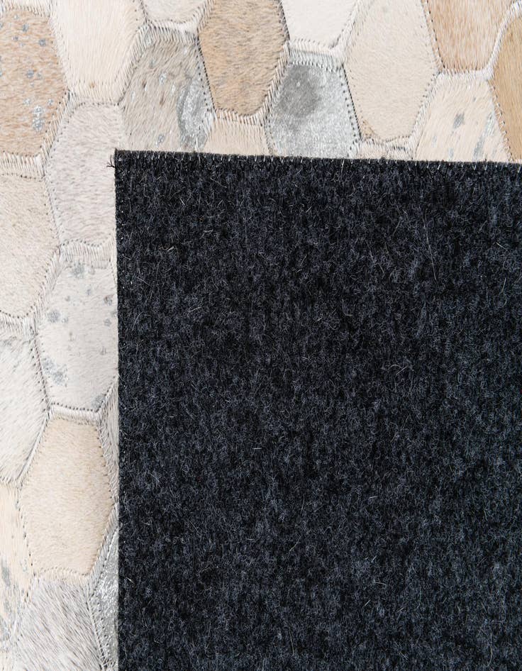 Detail image of 5' x 7' 11 Cowhide Stocks Rug