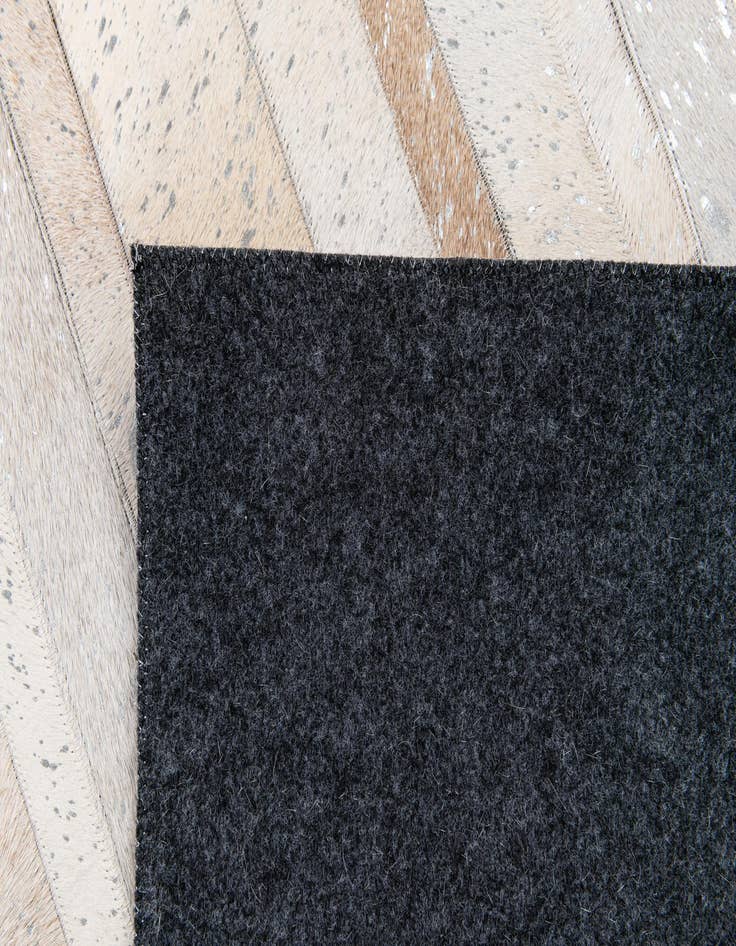Detail image of 5' 1 x 8' 1 Cowhide Stocks Rug