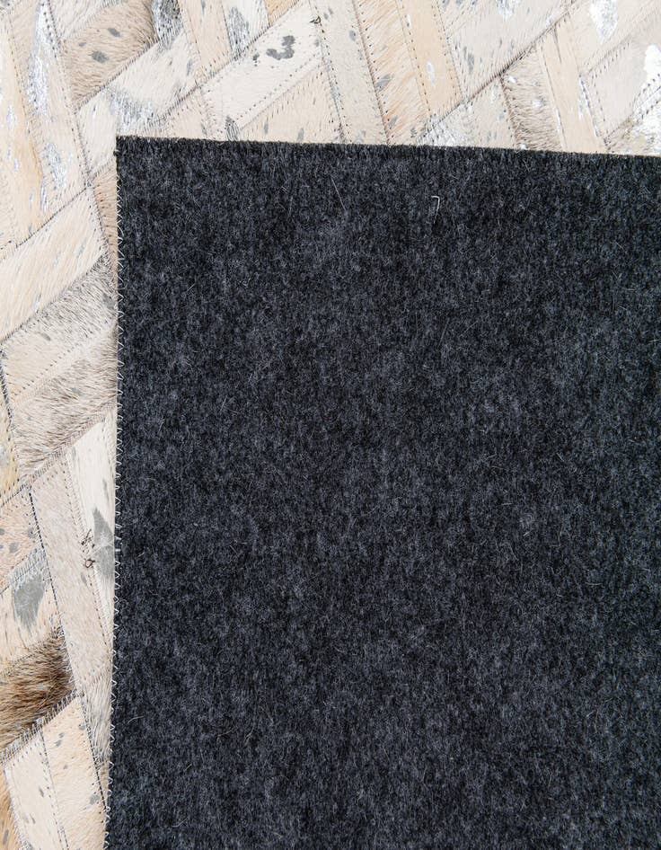 Detail image of 5' x 7' 11 Cowhide Stocks Rug