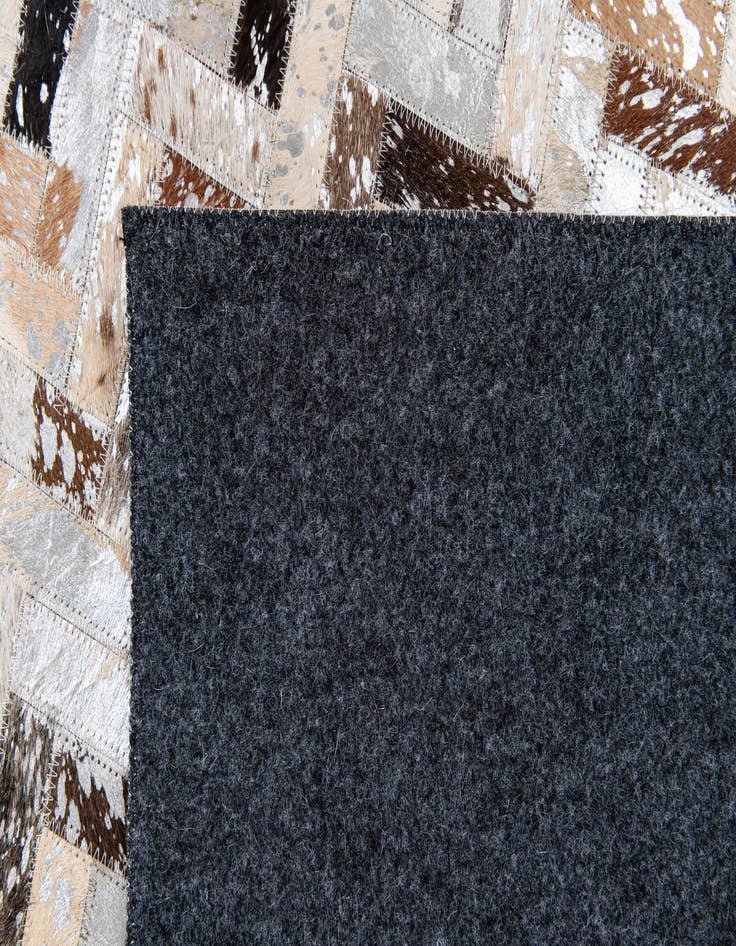 Detail image of 5' 3 x 7' 3 Cowhide Stocks Rug