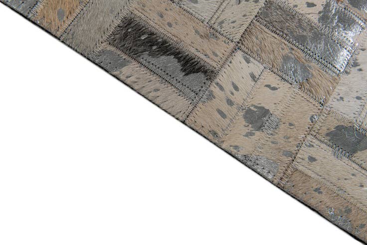 Detail image of 4' 11 x 8' 1 Cowhide Stocks Rug