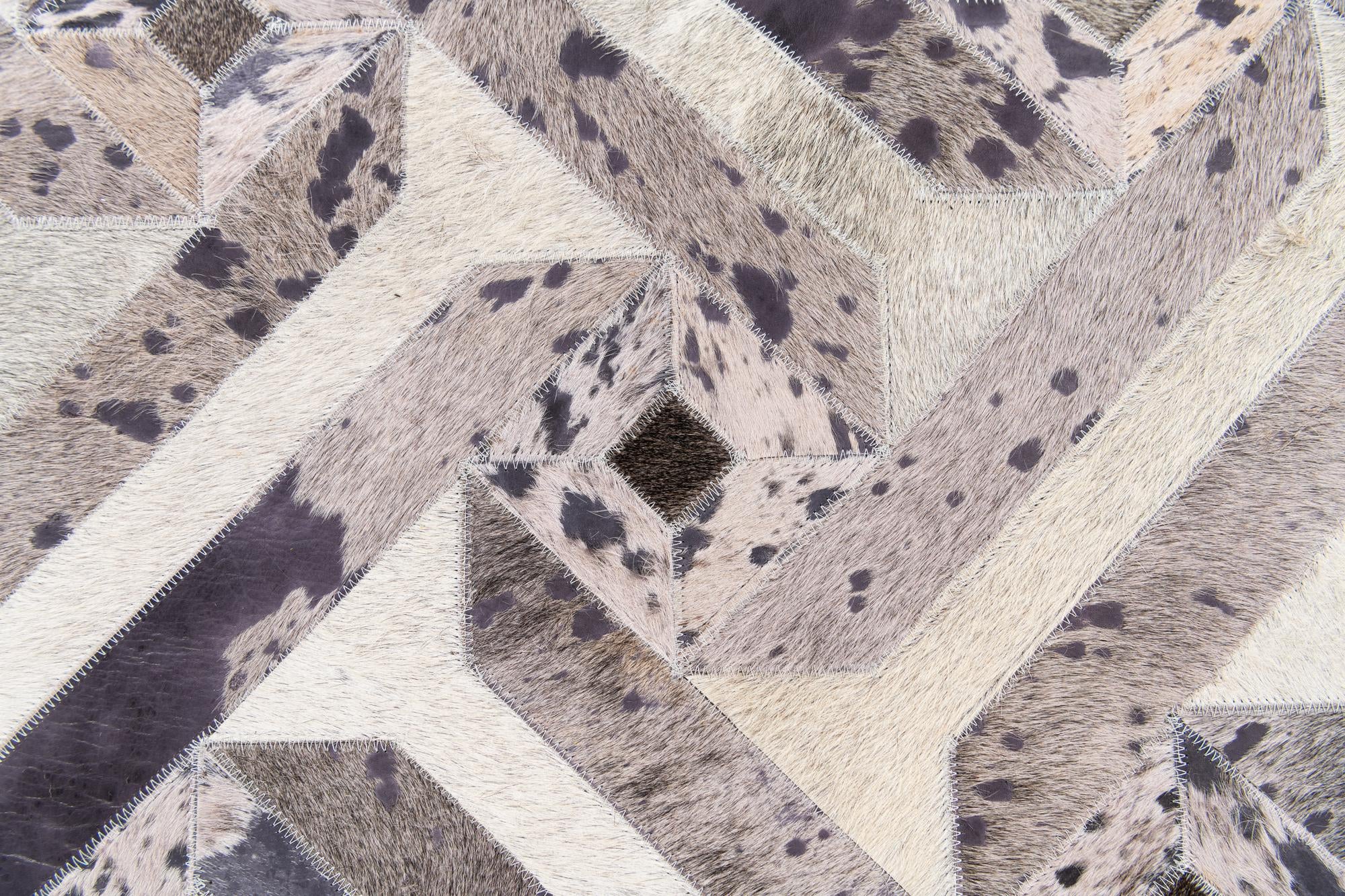 5' 2 x 8' 1 Cowhide Stocks Rug