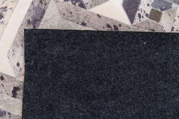 5' 2 x 8' 1 Cowhide Stocks Rug