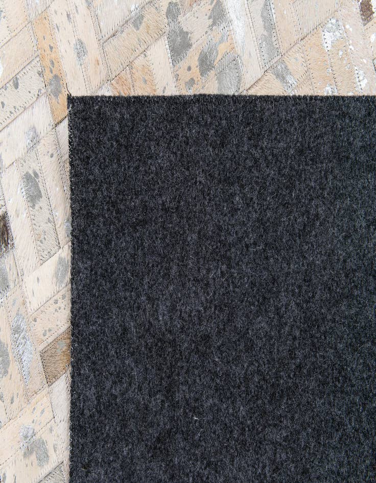 Detail image of 4' 11 x 8' 1 Cowhide Stocks Rug