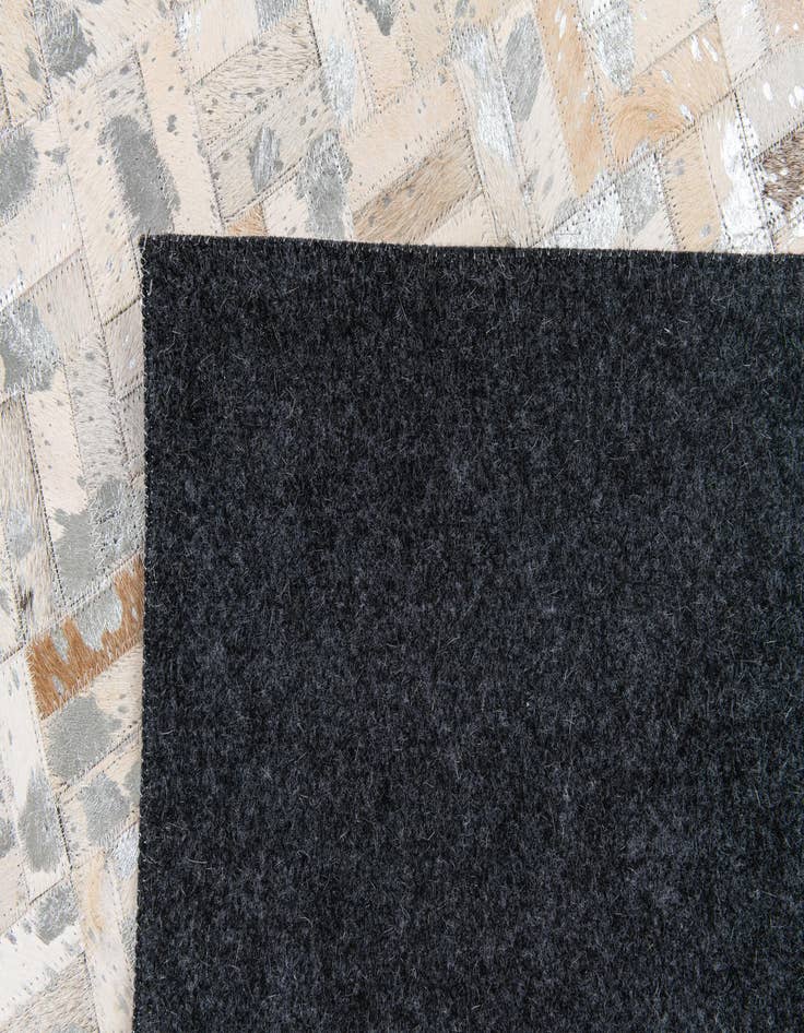 Detail image of 4' 11 x 8' 1 Cowhide Stocks Rug