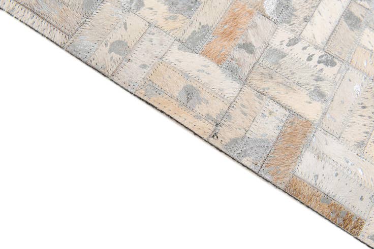 Detail image of 4' 11 x 8' 1 Cowhide Stocks Rug