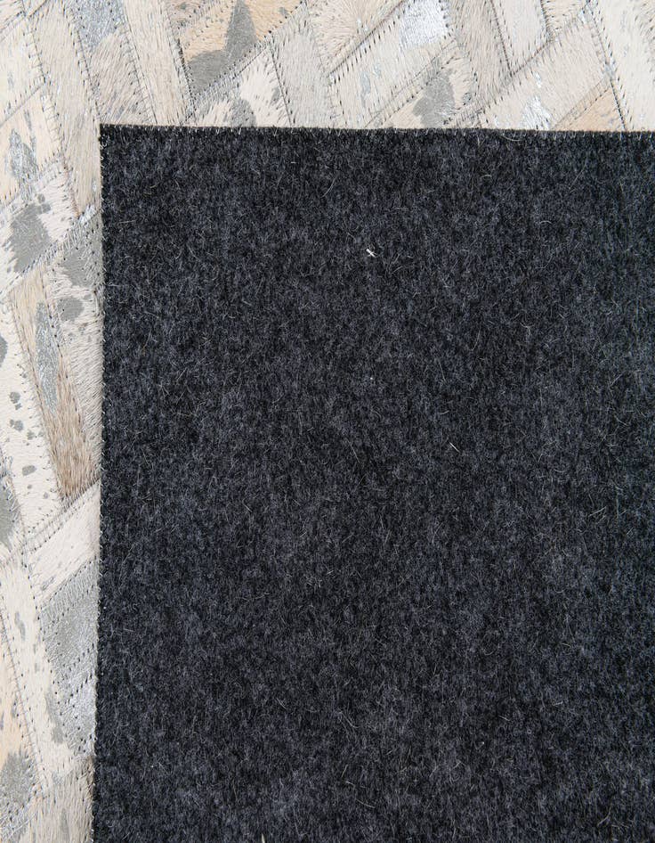 Detail image of 4' 11 x 8' 1 Cowhide Stocks Rug