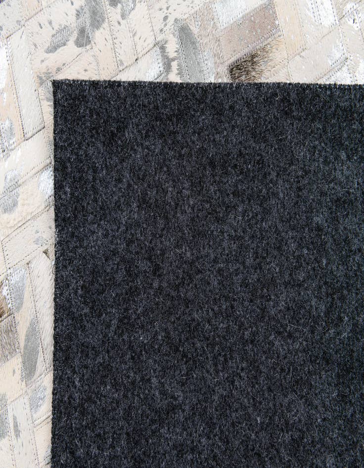 Detail image of 4' 11 x 7' 10 Cowhide Stocks Rug