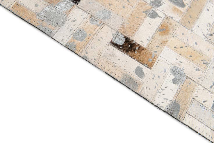 Detail image of 4' 11 x 8' 1 Cowhide Stocks Rug