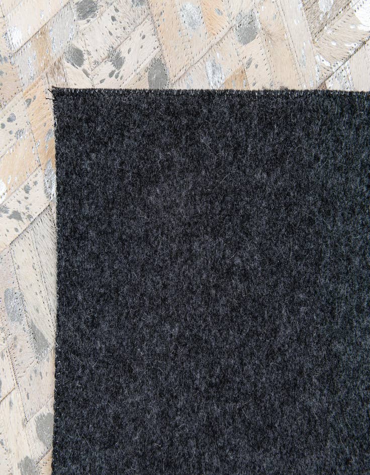 Detail image of 4' 11 x 8' 1 Cowhide Stocks Rug