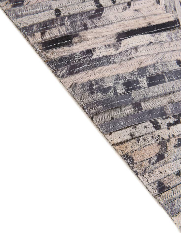 Detail image of 4' 11 x 8' 1 Cowhide Stocks Rug