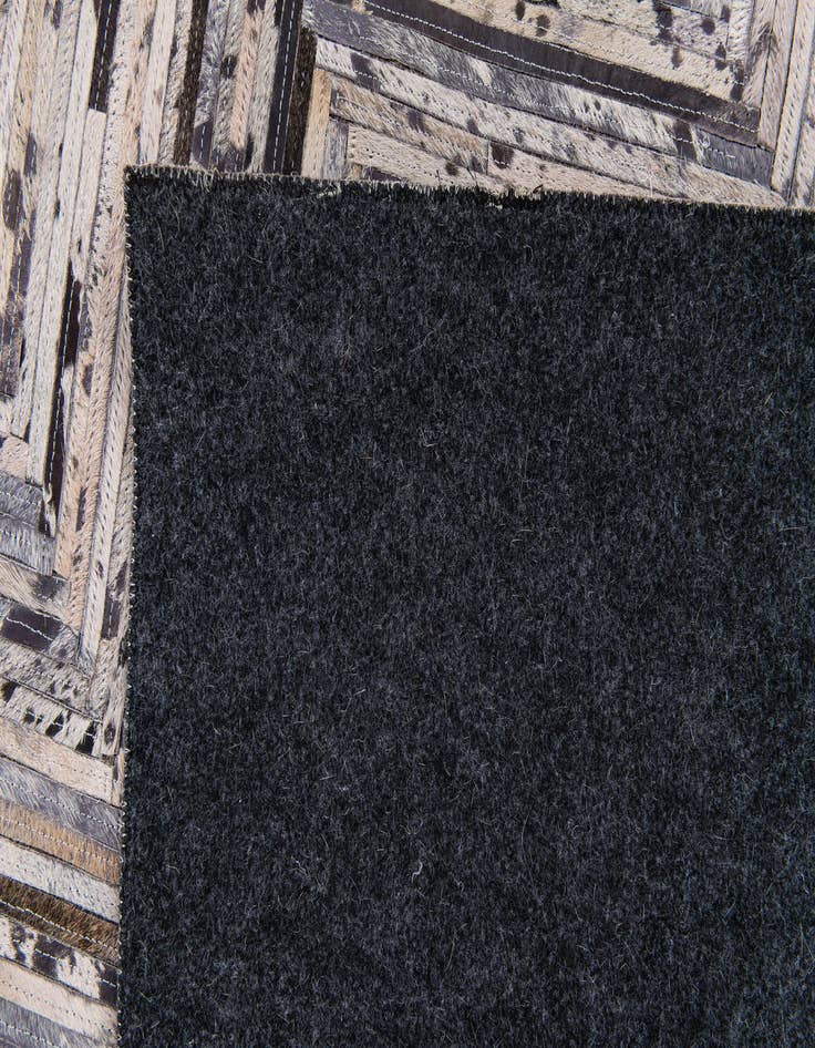 Detail image of 4' 11 x 8' 1 Cowhide Stocks Rug