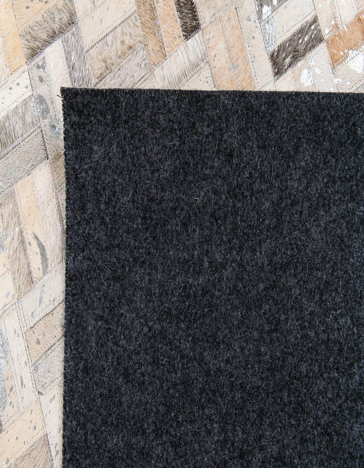 Detail image of 4' 11 x 8' 1 Cowhide Stocks Rug