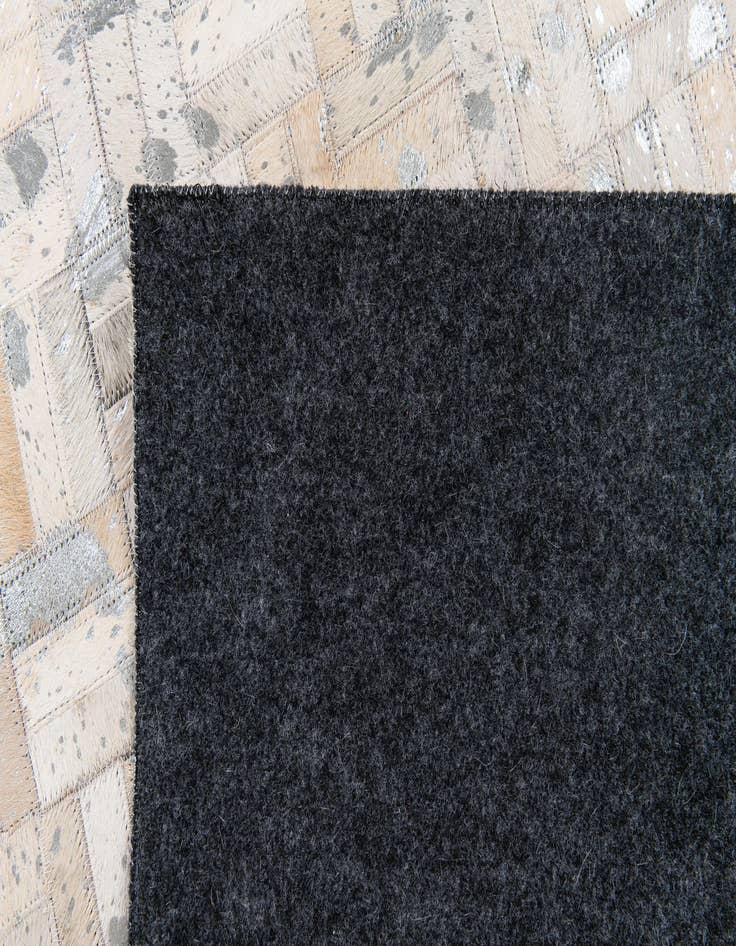 Detail image of 4' 11 x 8' 1 Cowhide Stocks Rug