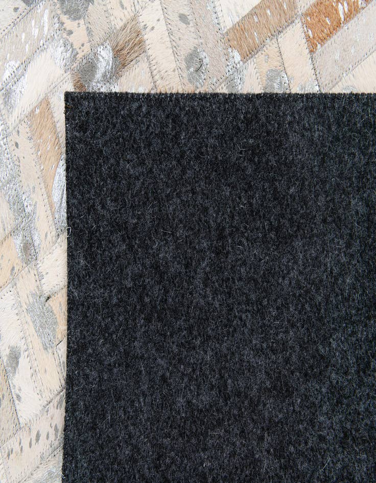 Detail image of 4' 11 x 8' 1 Cowhide Stocks Rug