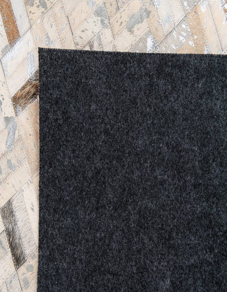 Detail image of 4' 11 x 8' 1 Cowhide Stocks Rug