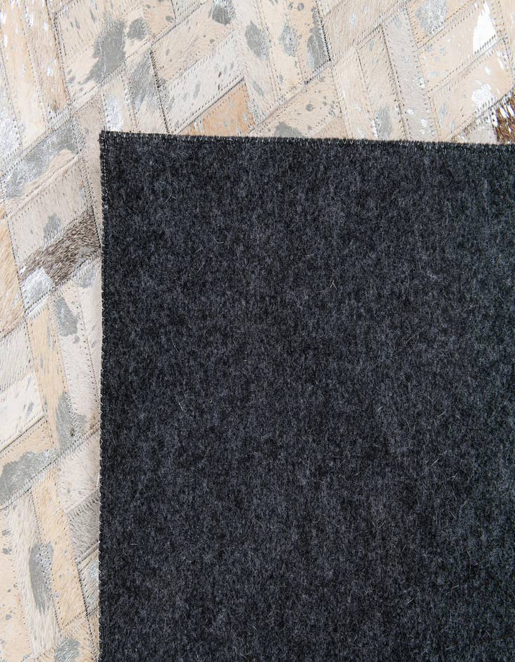 Detail image of 4' 11 x 8' 1 Cowhide Stocks Rug