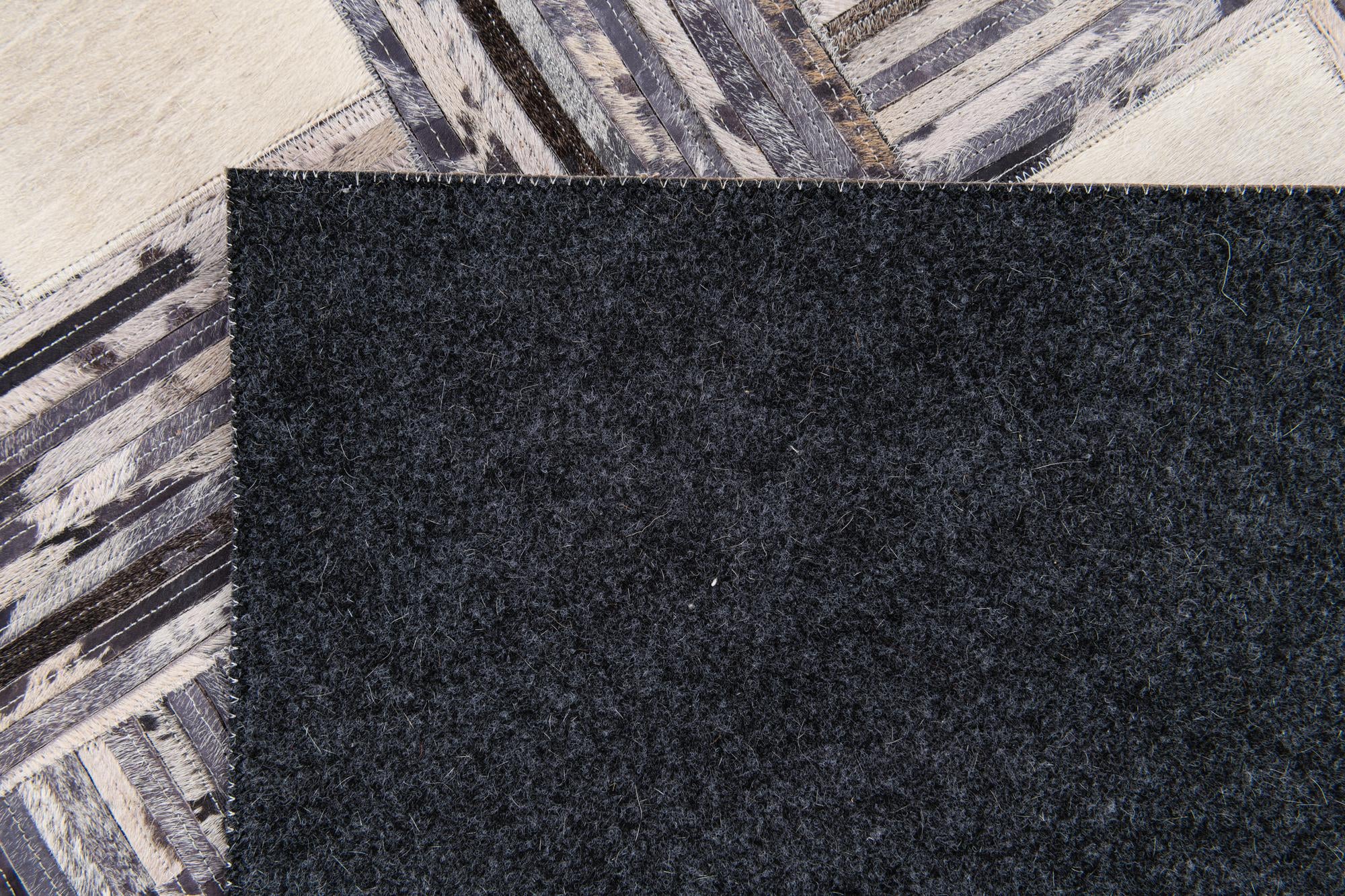 4' 11 x 7' 8 Cowhide Stocks Rug