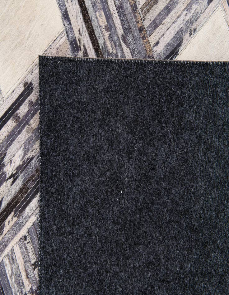 Detail image of 4' 11 x 7' 8 Cowhide Stocks Rug