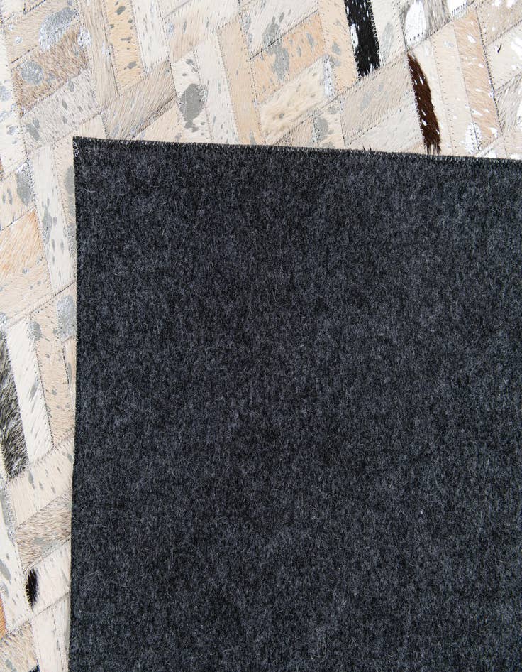 Detail image of 5' x 7' 11 Cowhide Stocks Rug