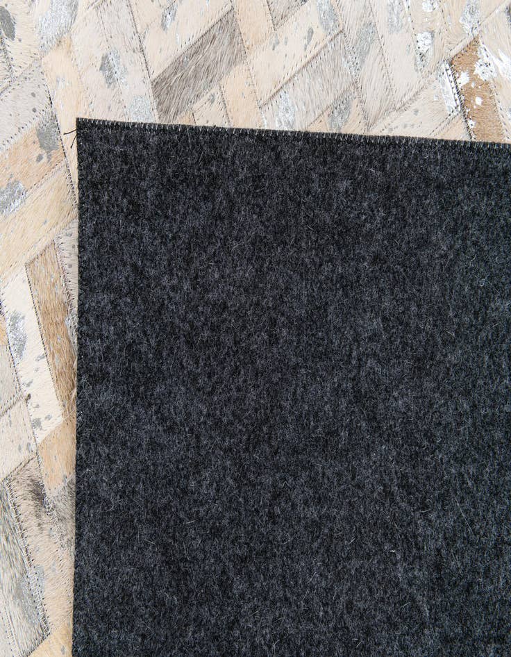 Detail image of 4' 11 x 8' Cowhide Stocks Rug