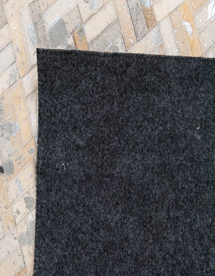 Detail image of 4' 11 x 8' 1 Cowhide Stocks Rug