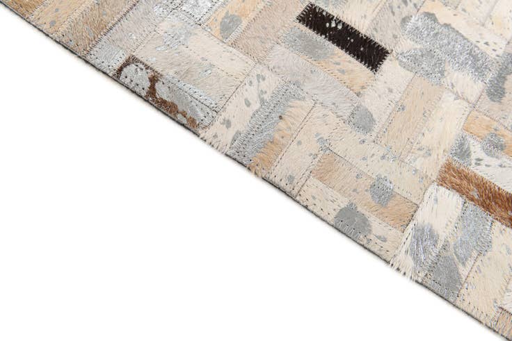 Detail image of 4' 11 x 8' 1 Cowhide Stocks Rug